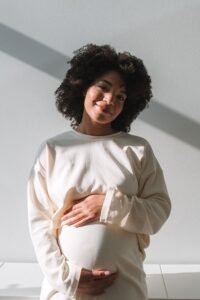 mom holding pregnant stomach