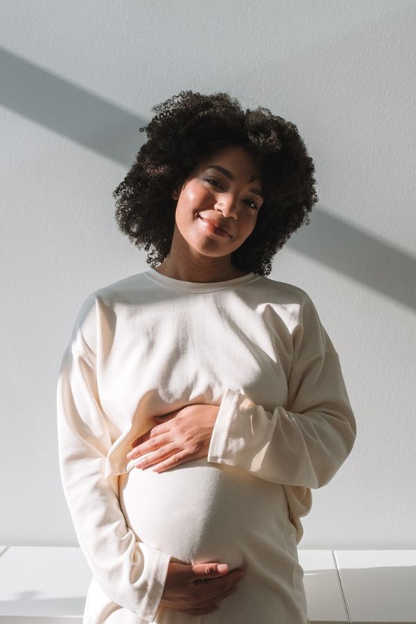 mom holding pregnant stomach