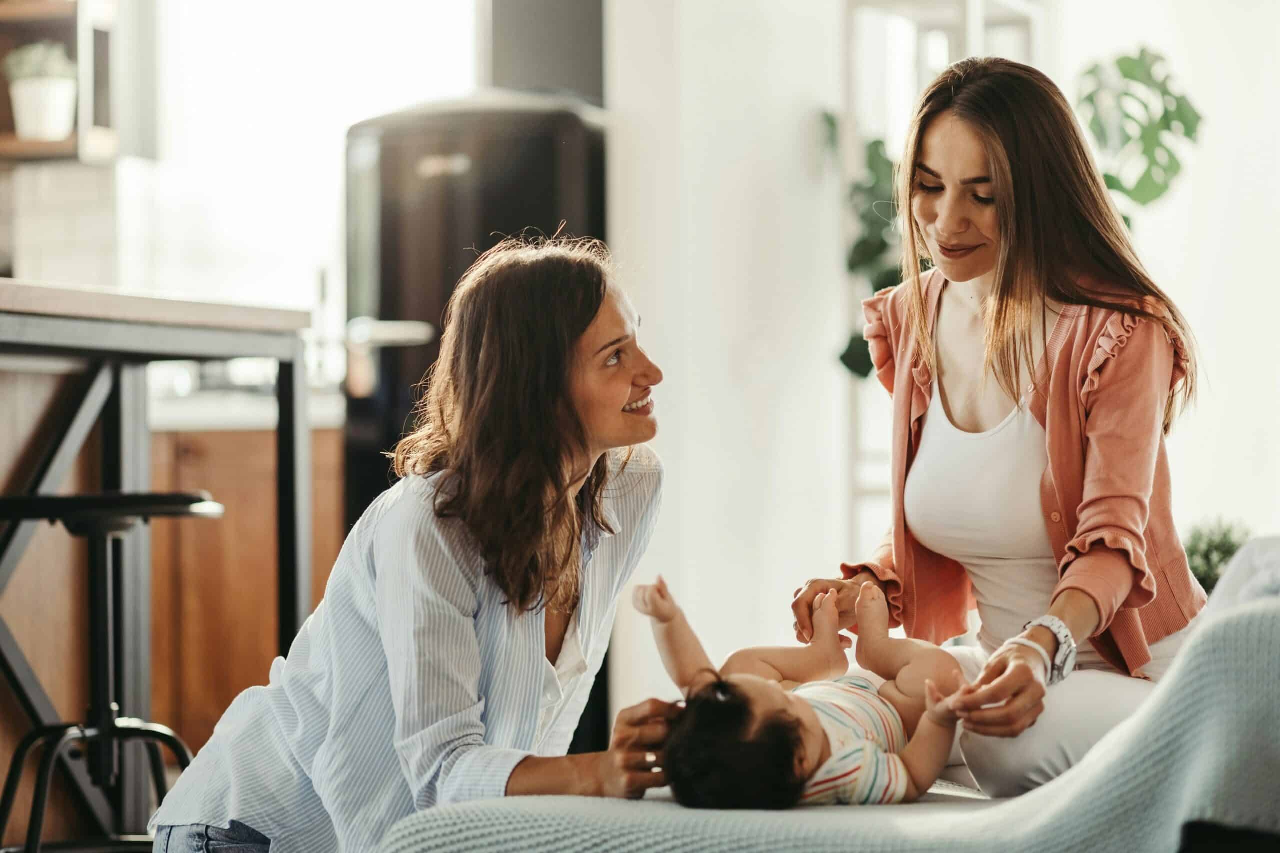 new baby with doula helping