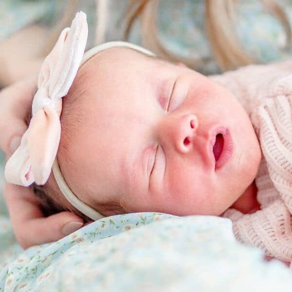 Sleeping baby with bow