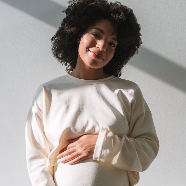 mom holding pregnant stomach