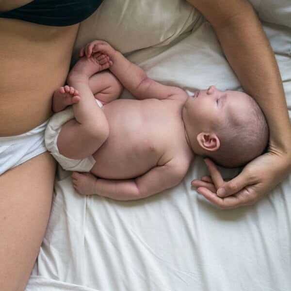 newborn next to mother