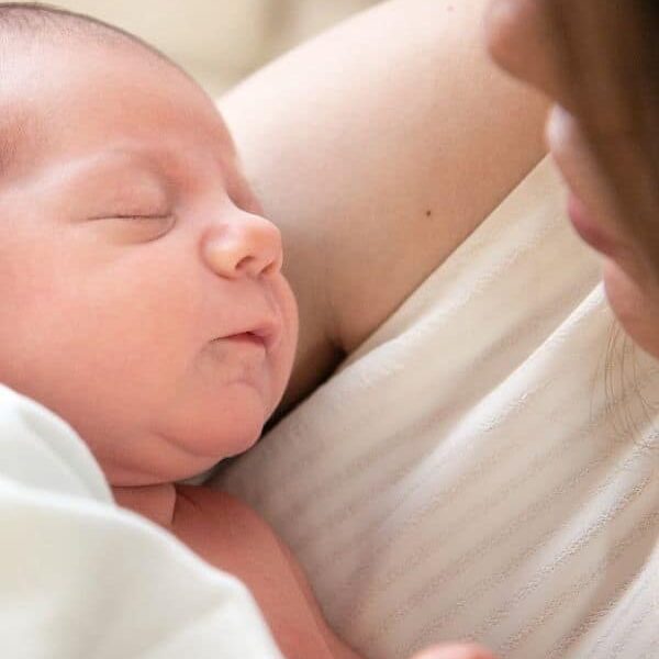 parent looking at newborn