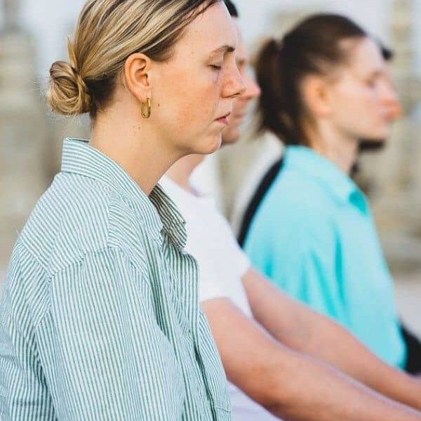 people meditating during yoga